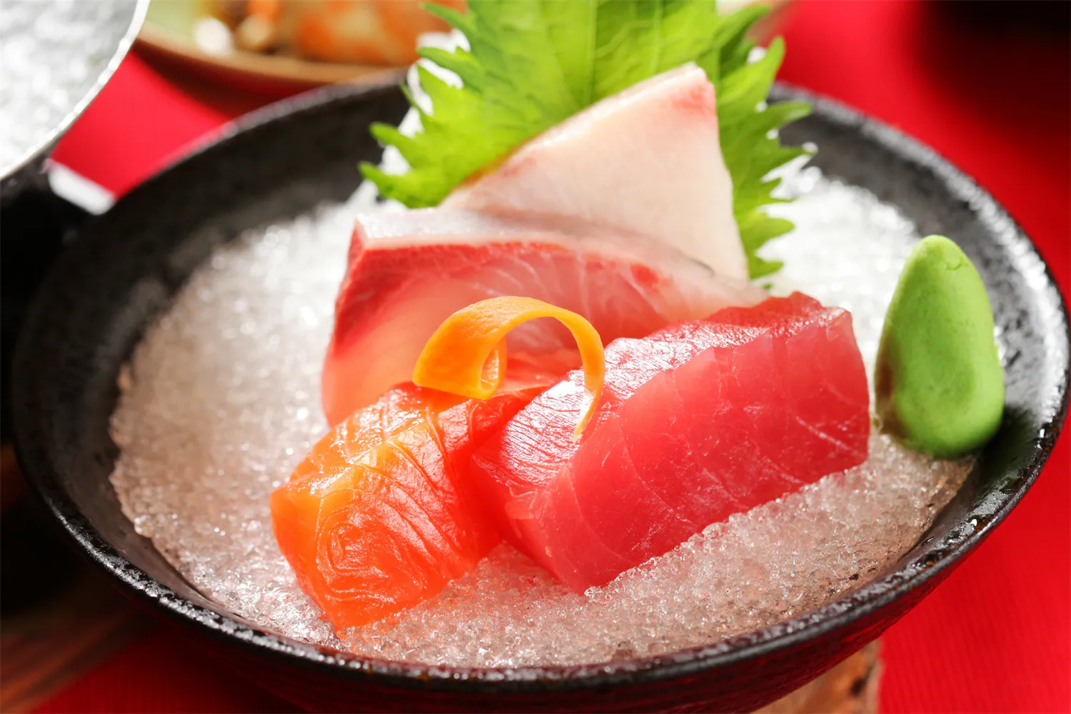 Chilled tuna and salmon sashimi served on crushed ice with wasabi garnish at Cucumber Sushi, a Japanese Restaurant in Jersey City